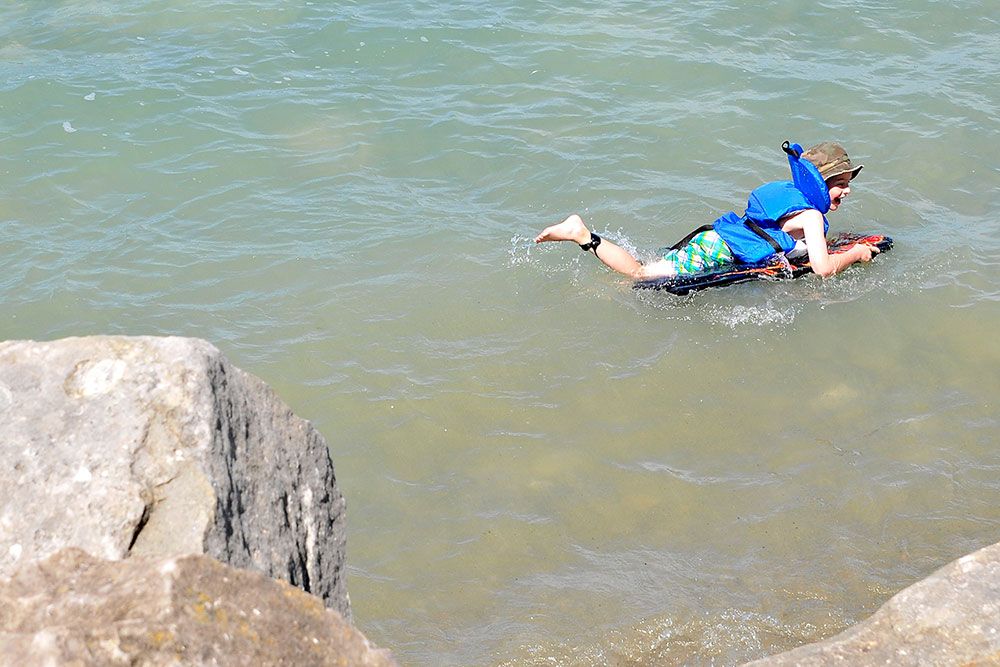 A file photo of a young person swimming in the lake.